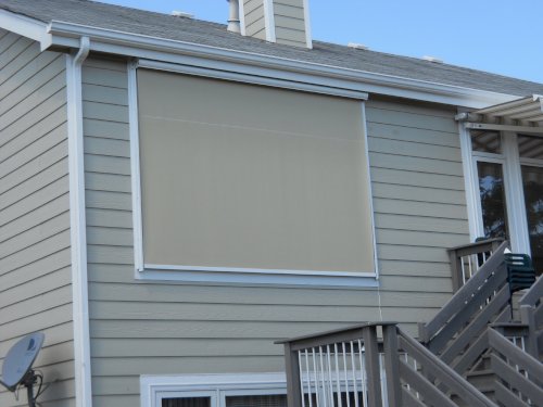 Clean solar shades allowing natural light into a home while also blocking out solar heat gain.