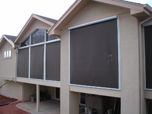 Well-maintained solar shades for windows that are keeping a home cooler and more energy efficient.